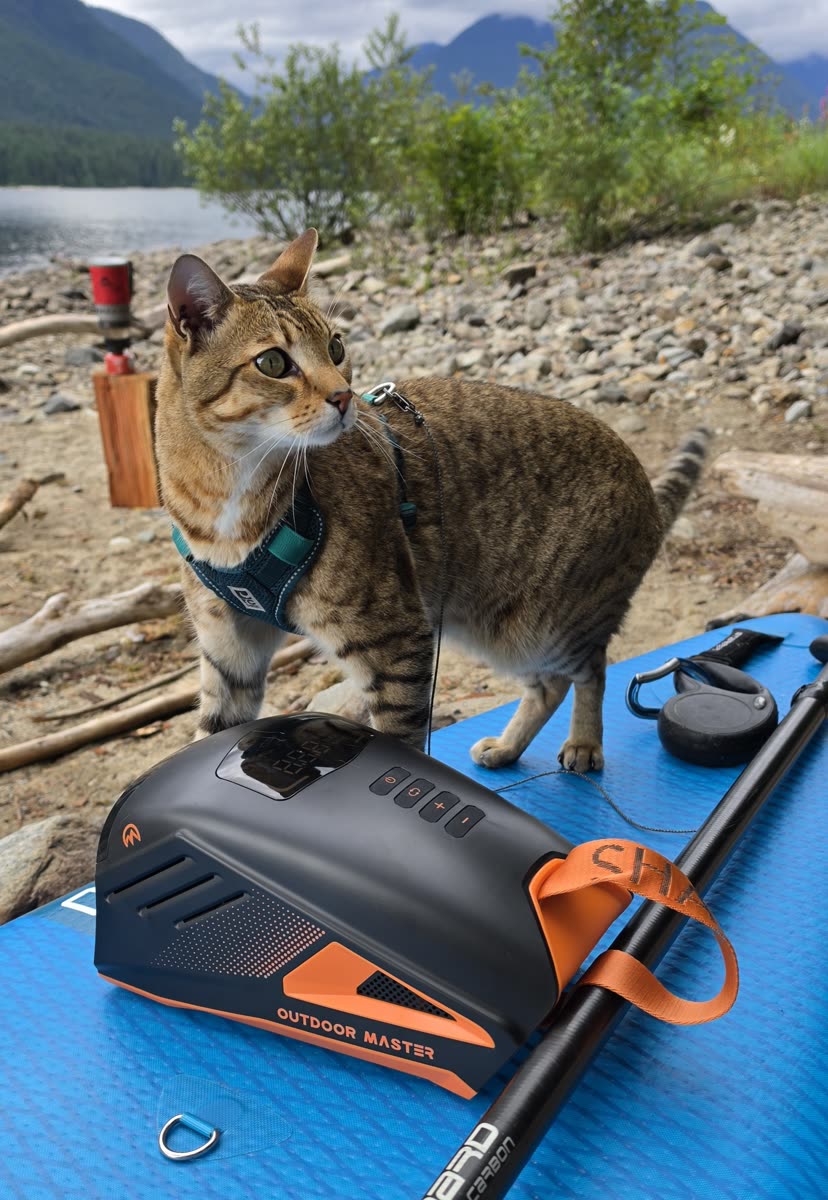 Outdoor Master SHARK 3 Rechargeable Electric SUP Pump on a paddleboard with Findus